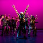 CAT head image for homepage Centre for Advanced Training, dancing group in front of a dramatic magenta backdrop