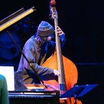 CoLab_24_Finale_SLG_APPROVED_hi-res_0135_rgb A student wearing a knitted hat plays a double bass