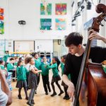 Jazz in Schools - St Alfege - (c) Alex Brenner. No use without credit. A group of school children listen to jazz music played by Trinity Laban undergraduate students.